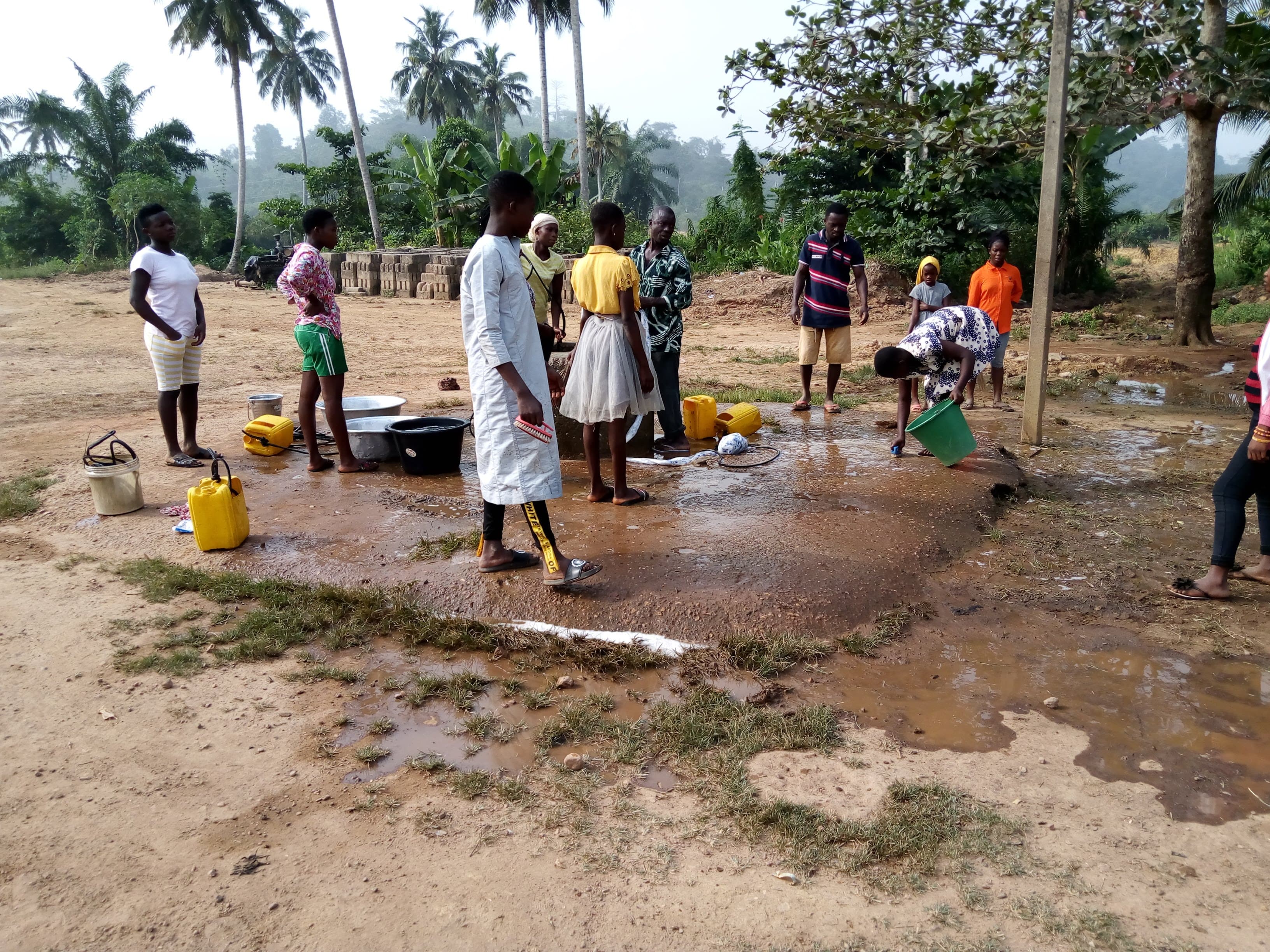 Community members cleaning together — Surano B